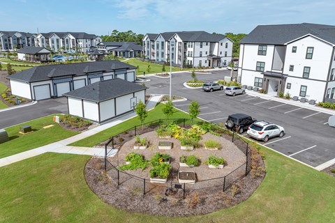 Drone footage of community garden near the garages.