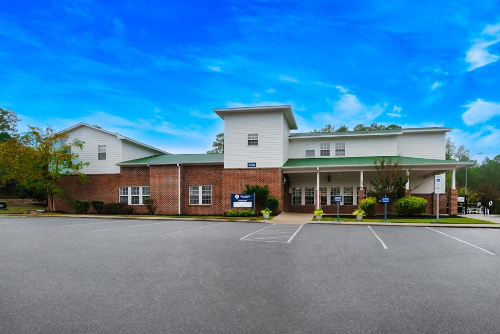 the building where the hotel is located is spacious and has a parking lot