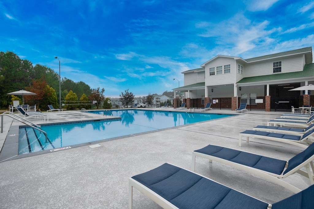 our apartments have a large pool and lounge chairs