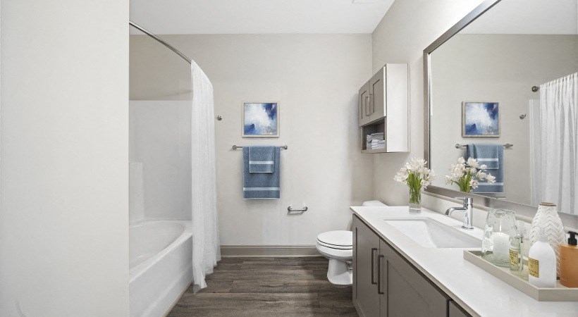 a bathroom with a sink toilet and a bath tub