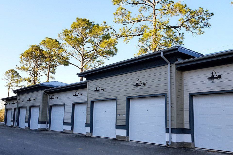 a row of garage doors on the side of a building