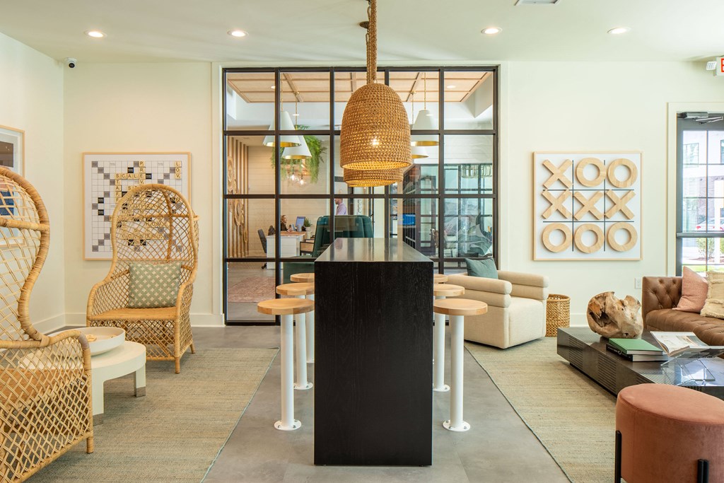 a living room and dining room with a table and chairs