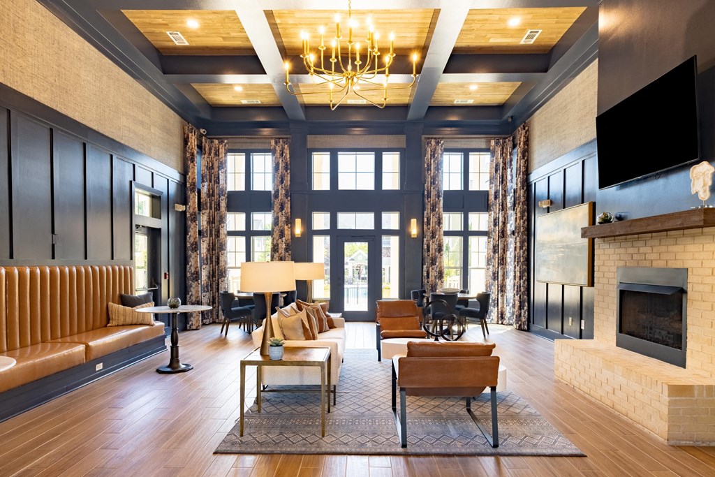 a living room filled with furniture and a large window