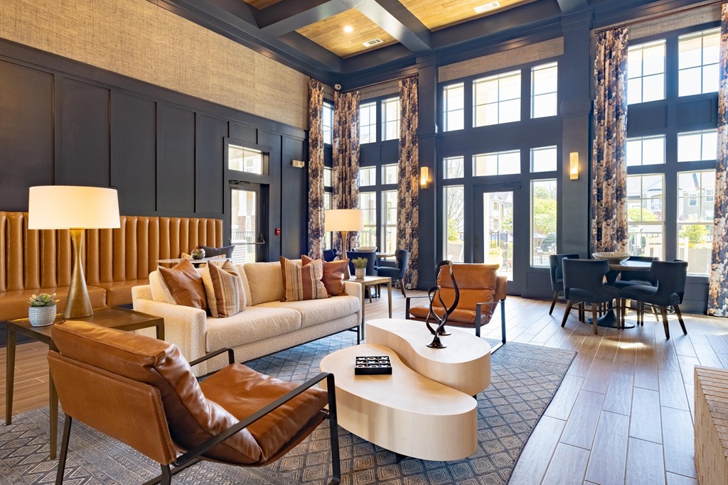 a living room filled with furniture and a large window