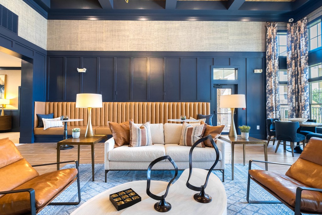 a living room filled with furniture and a large window