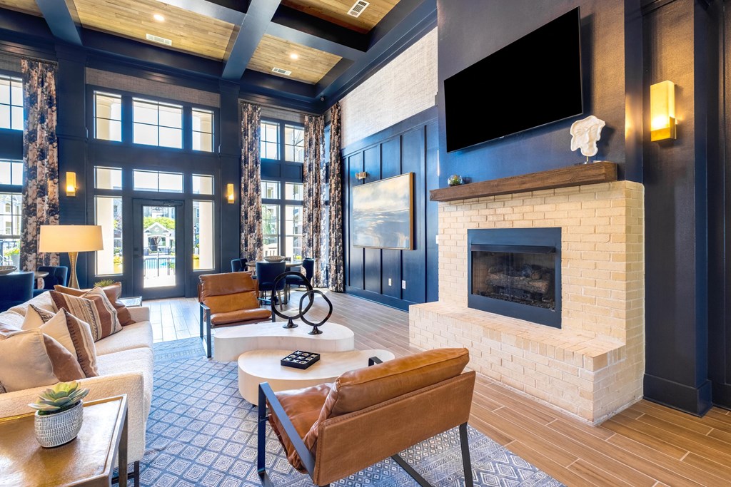 a living room filled with furniture and a large fireplace