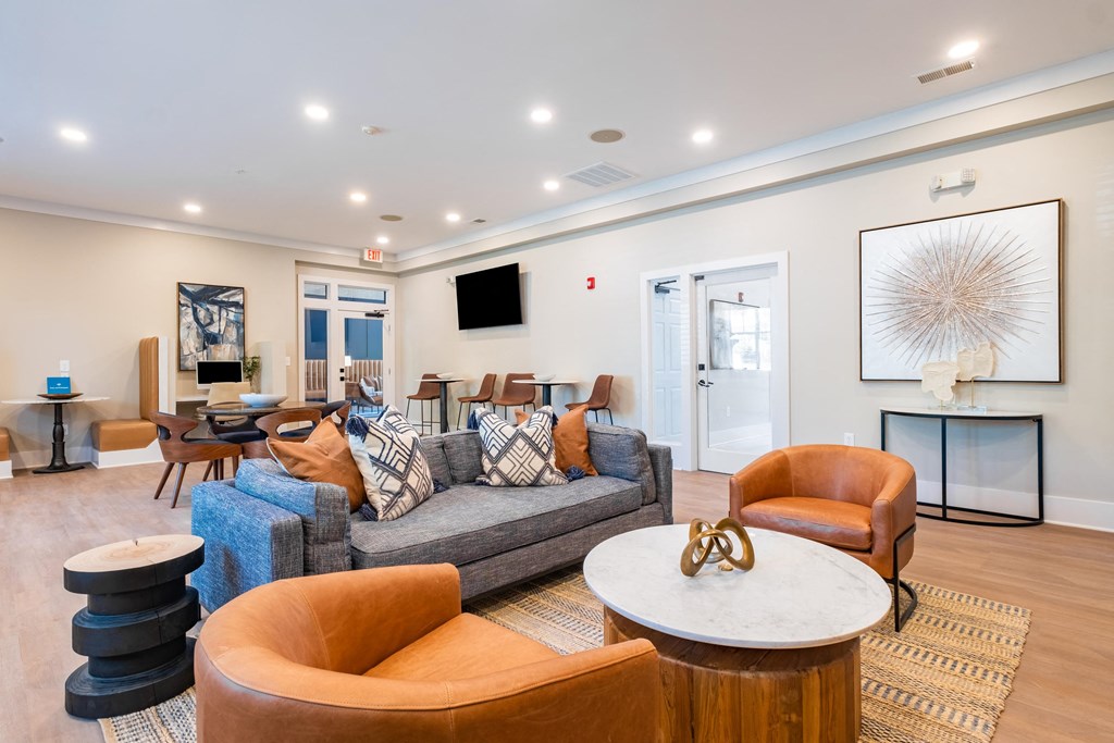 a living room filled with furniture and a flat screen tv