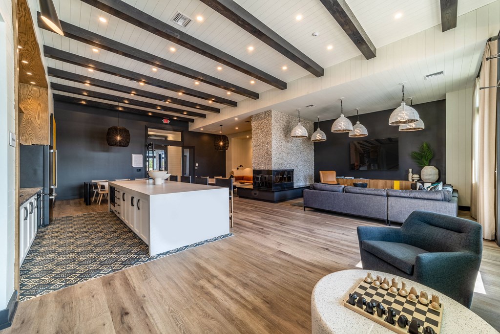 a lobby with couches and a table with a chess board