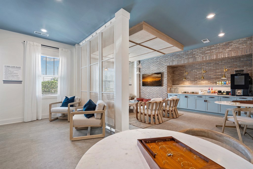 a living room with a kitchen and a dining table