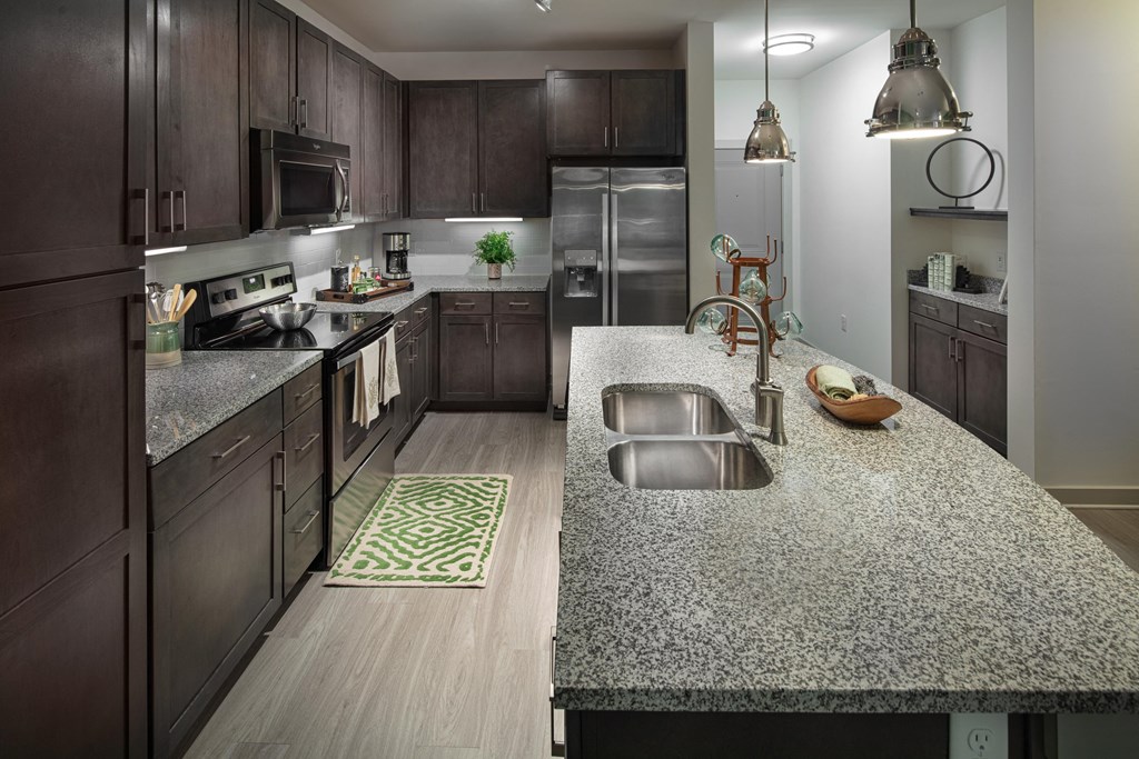 Vestavia Reserve kitchen with a granite counter top and stainless steel appliances.