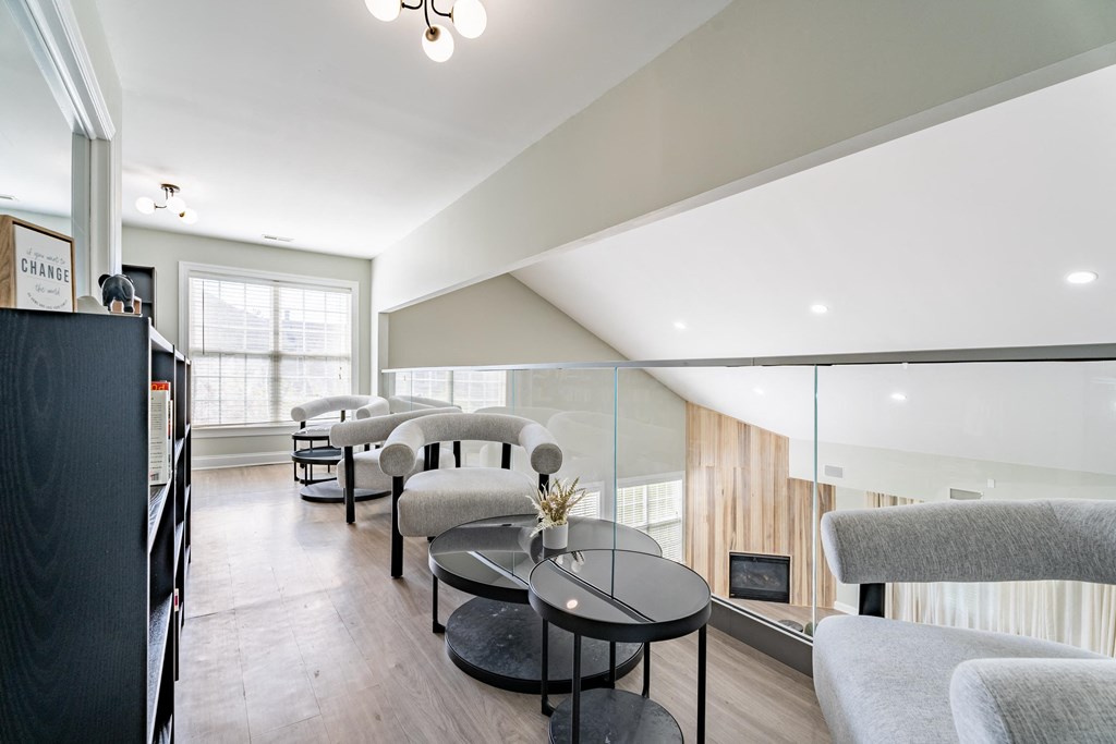 a living room with couches and chairs and a table