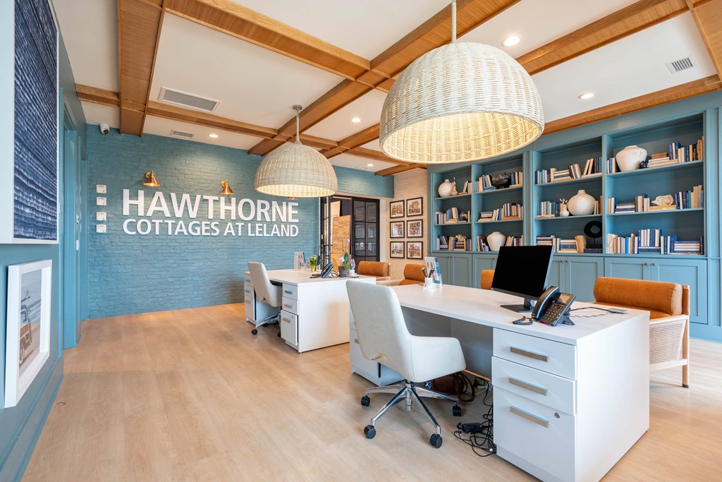 a home office with blue and white walls and a desk with a computer