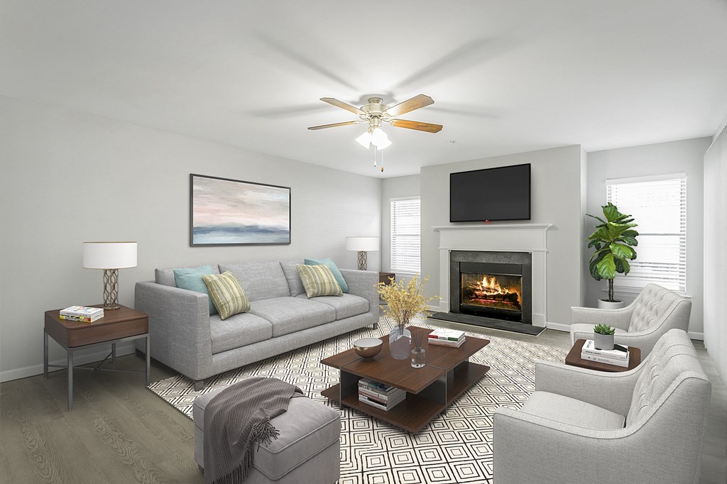 a living room with a fireplace and couches