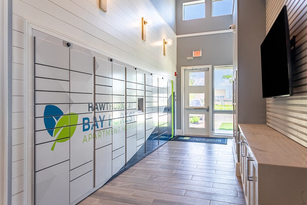 a hallway with a door to the hawthorne bay apartment building