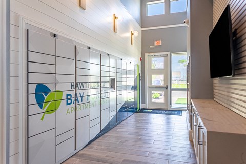 a hallway with a door to the hawthorne bay apartment building