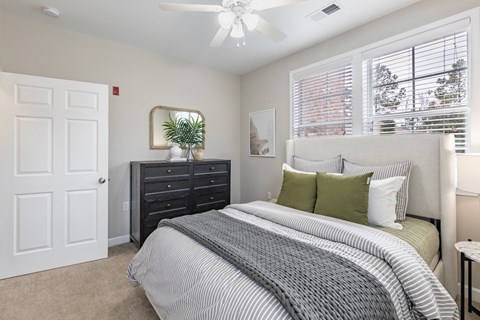 a bedroom with a bed and a closet