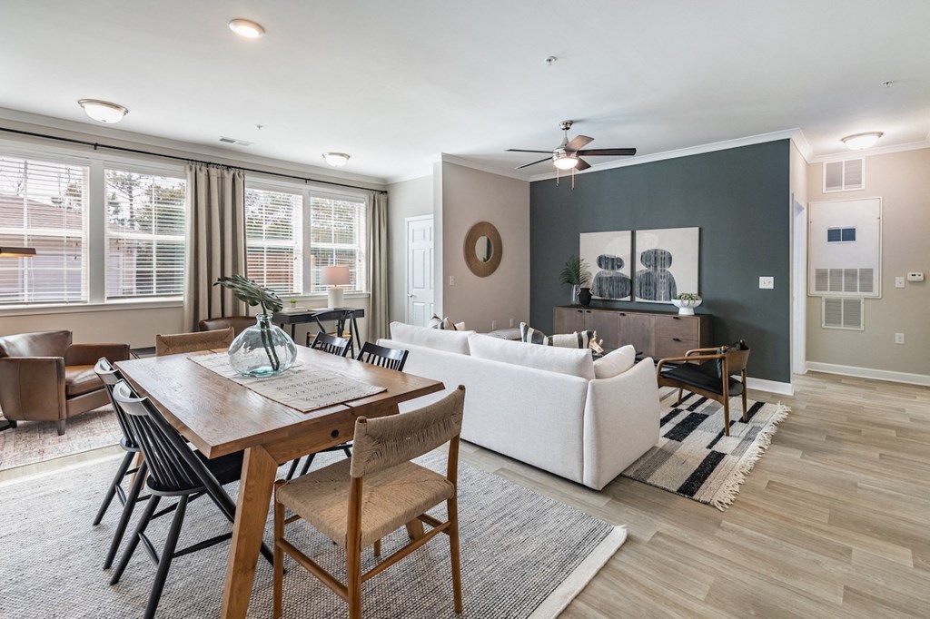 an open living room and dining room with a couch and a table