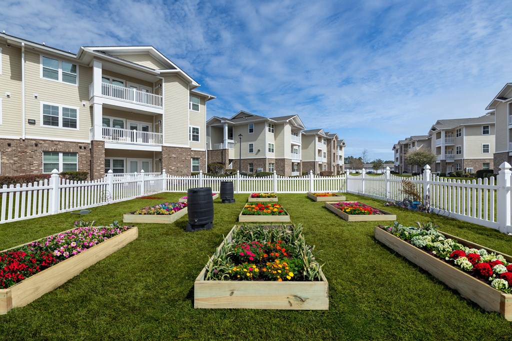 a community garden in front of an apartment building