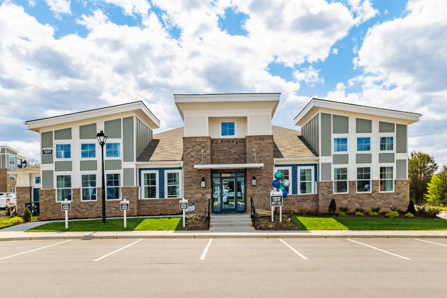 a large building with a parking lot in front of it