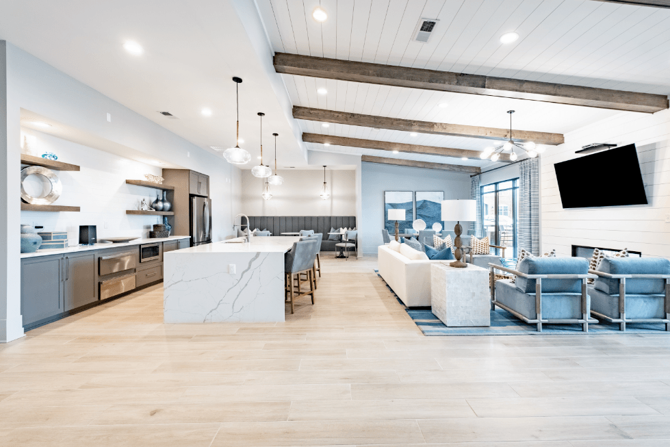 a living room with a kitchen and a dining room