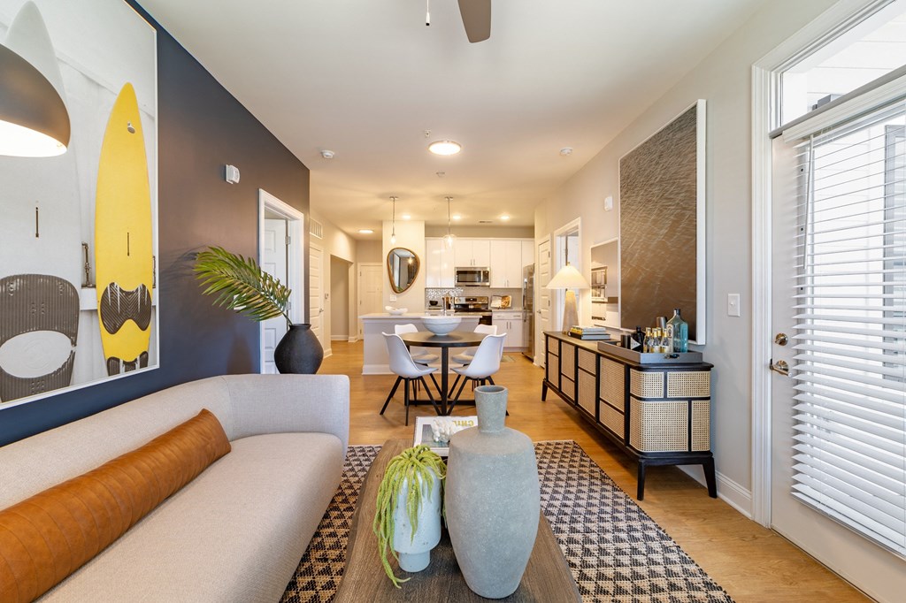 a living room with a couch and a table with chairs