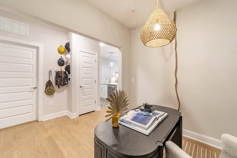Home Interior a dining room with a table and a door to a bathroom