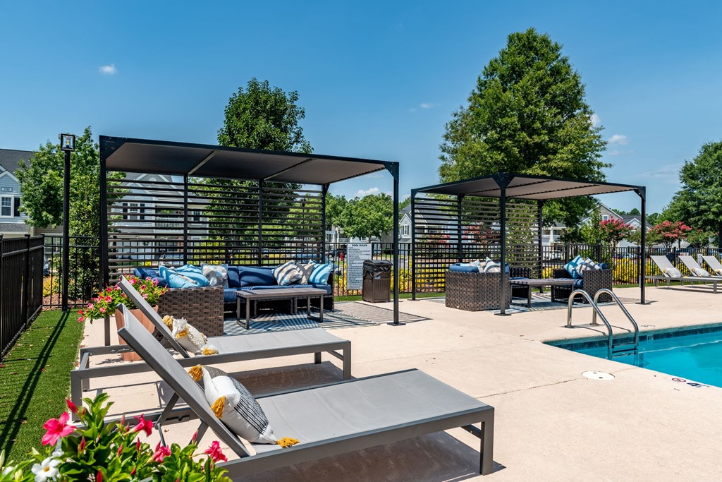 our apartments have a large pool and lounge areas with furniture