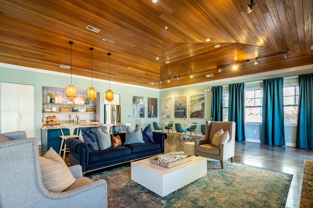 a living room with couches and chairs and a table