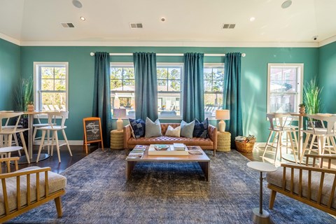 a living room with blue walls and a couch and a coffee table