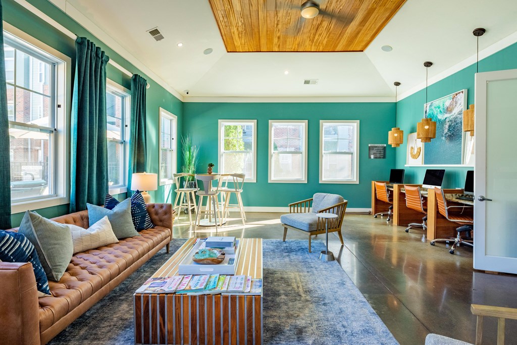 a living room with blue walls and a couch and a table