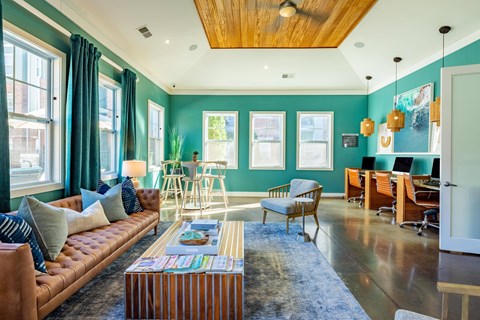 a living room with blue walls and a couch and a table