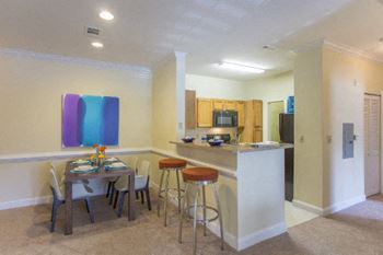 Gather around the breakfast bar in your kitchen at Hawthorne at the Meadows