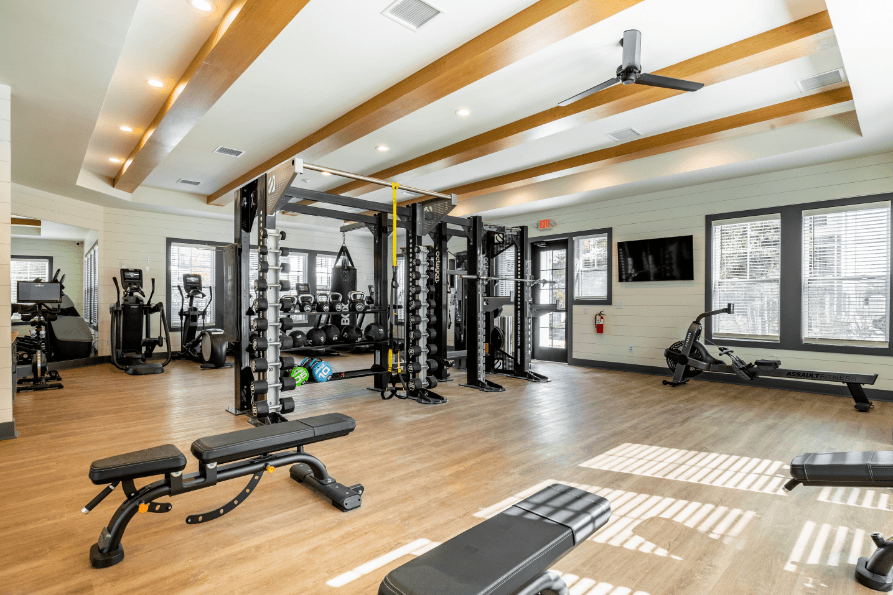 Expansive Fitness Center Equipped with Bikes, and Free Weights
