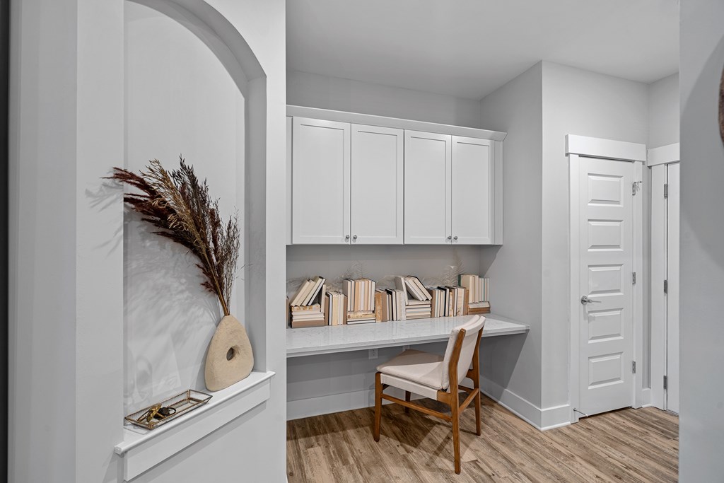 A built-in desk, chair, and bookshelf.