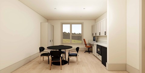 A modern kitchen with a round table and chairs.