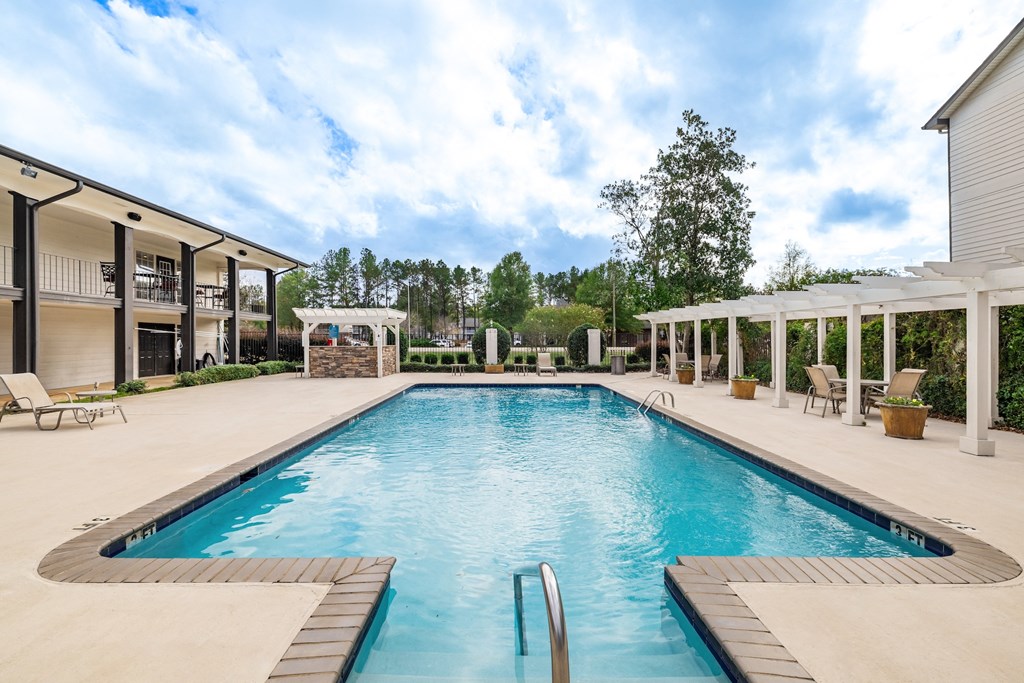 A large rectangular pool with a diving board in the middle.