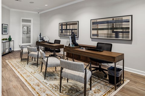 A Room with Two Desks and Chairs Next to Each Other.