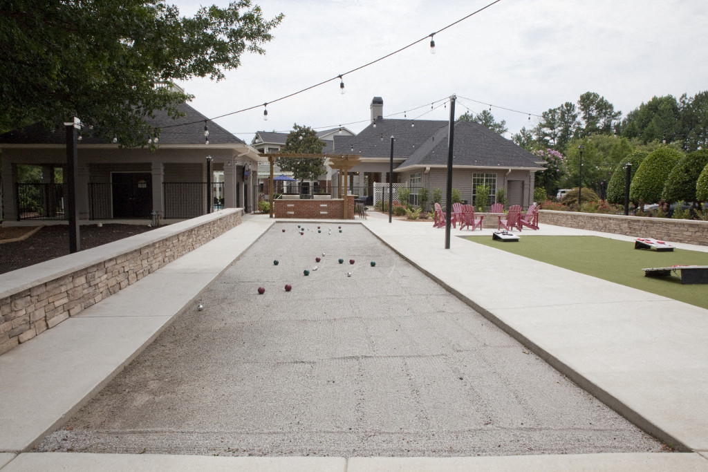 a bocce ball court in front of a house