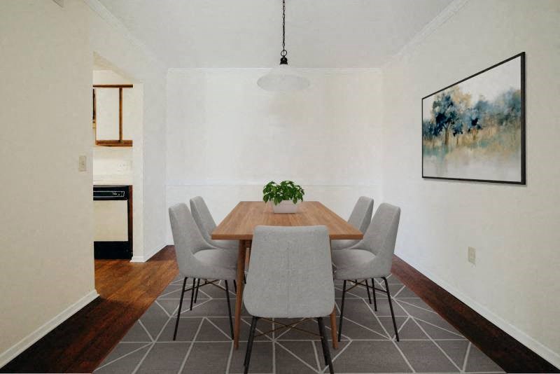 a dining room with a wooden table and chairs