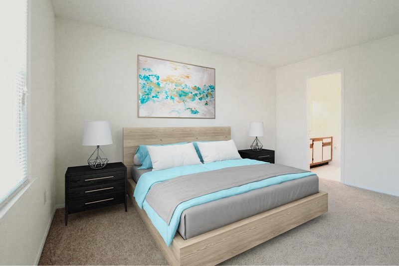 a bedroom with a bed and a painting on the wall