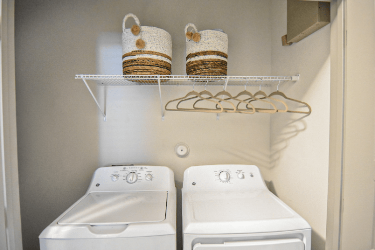 the laundry room has two washers and two dryers