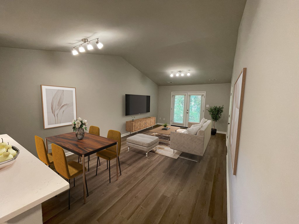 the view of a living room and dining room from the staircase