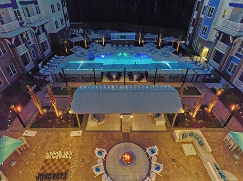 an aerial view of a pool at night