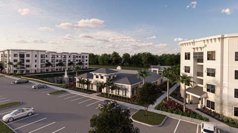 an aerial view of an apartment complex with cars in a parking lot