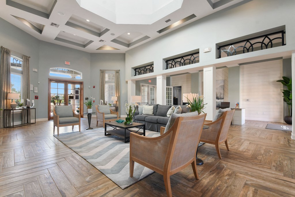 a living room with a couch and chairs