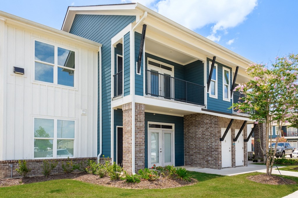 a blue and white building with a balcony