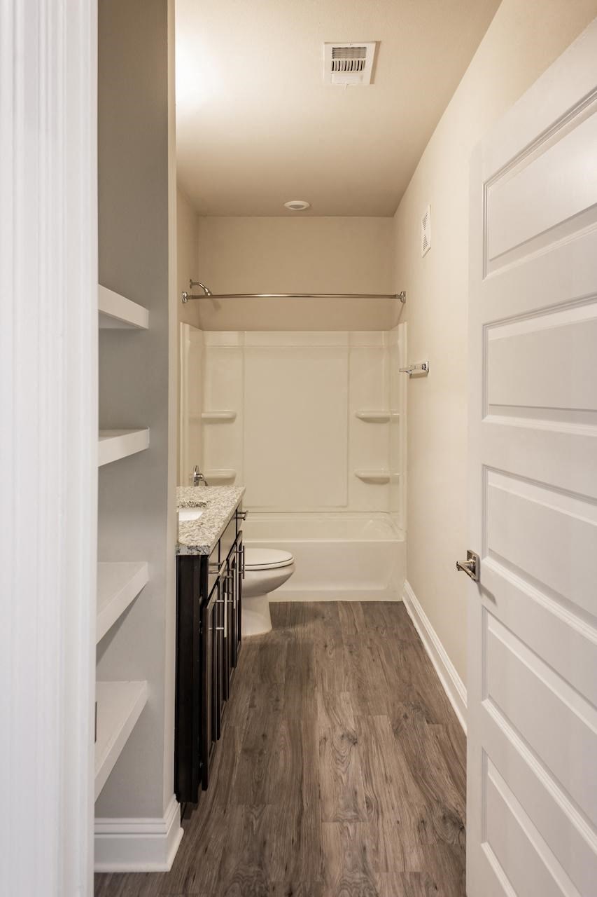 a bathroom with a toilet and a sink
