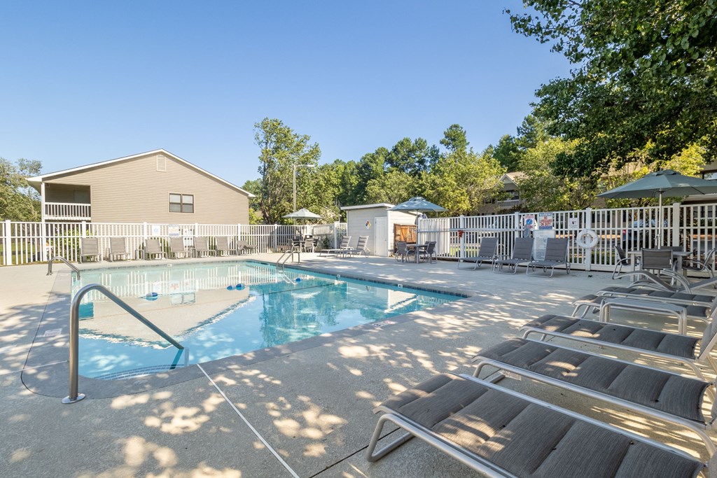 our resort style swimming pool is next to our buildings and has lounge chairs