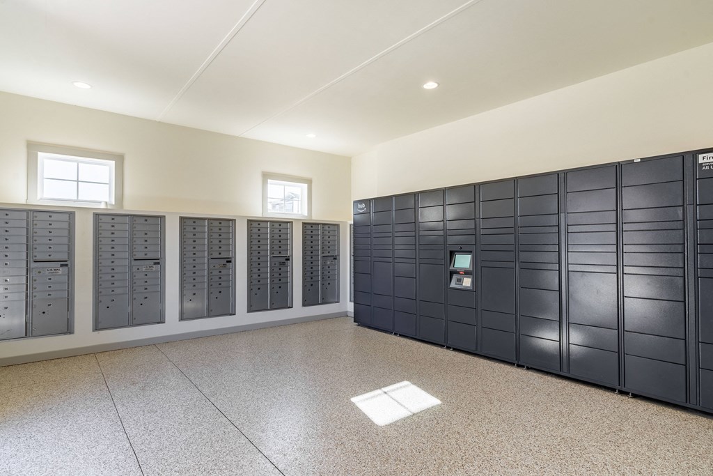 a group of lockers in a room with a tile floor