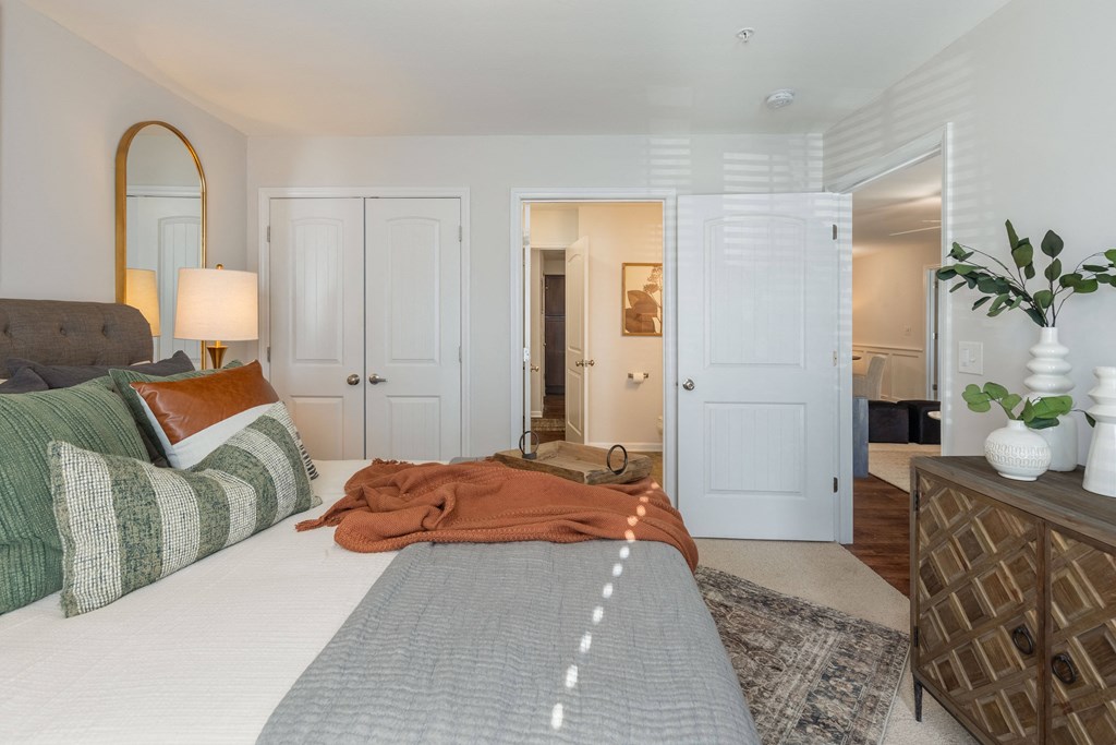 a bedroom with a bed and a closet